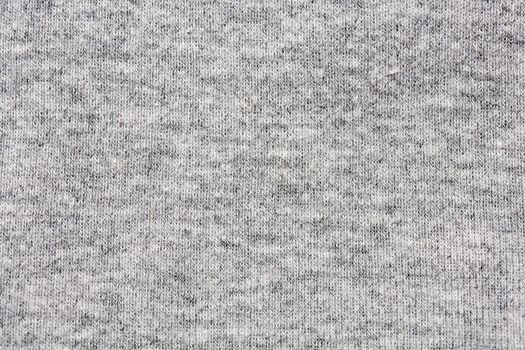 High resolution close up of gray cotton fabric with seams crossing.