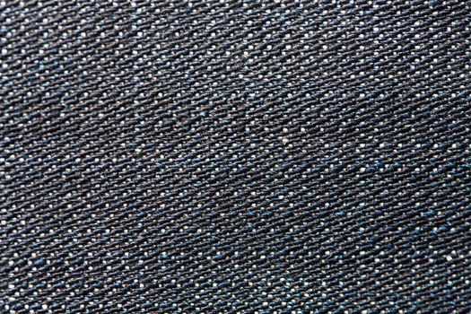 Dark jeans fabric with a visible structure as a background