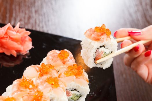 sushi with chopsticks