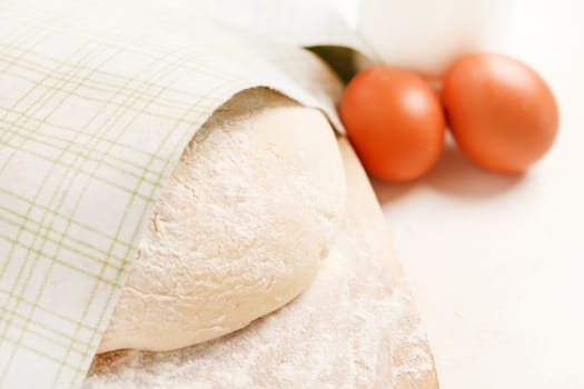 Dough on wooden board