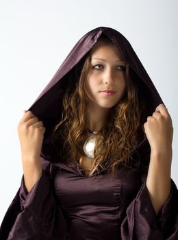 portrait of young pretty girl posing sitting in studio