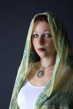 portrait of young girl stylized as indian in studio