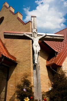 cross near the church in sunny spring day