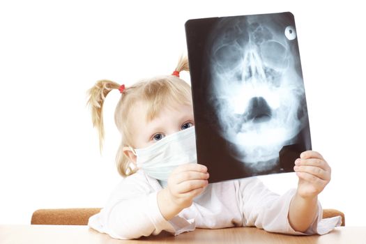 child playing as a doctor with X-ray photograph