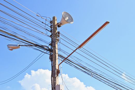 Electricity post in blue sky and clouds