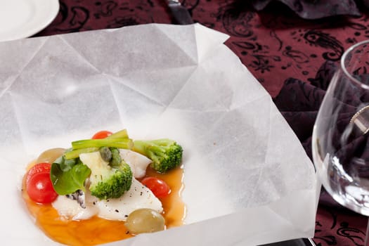 fish with vegetables in the parchment