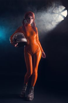 Sexy girl in latex catsuit holding helmet, sci-fi setting 
