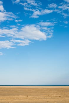 Blue sky and golden sand, a nature background