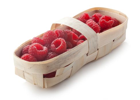 Some fresh raspberries in the wooden punnet