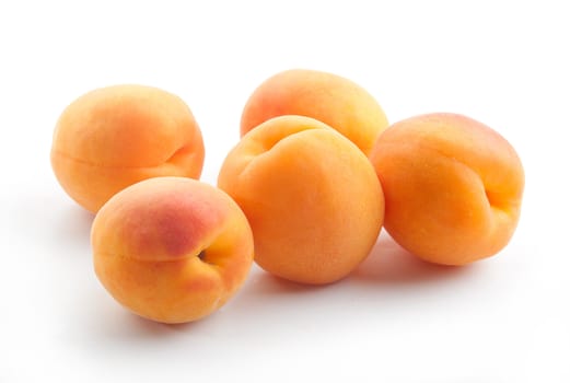 handful of fresh apricots on the white background