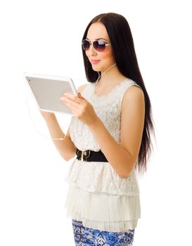 Young girl talks by tablet PC isolated