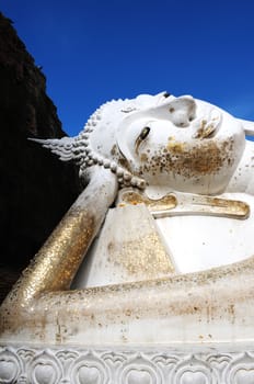 Giant Reclining Buddha at an Ancient buddhist wat in Ayutthaya, Thailand