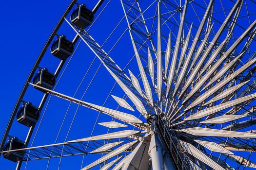 White ferris wheel in blue sky