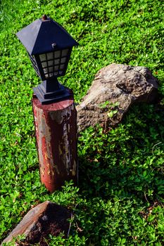 Garden lamp in morning sunlight