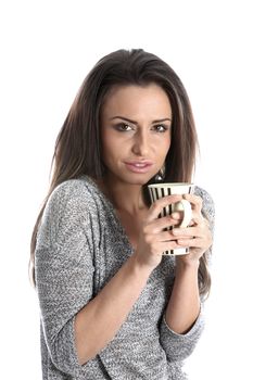 Model Released. Woman Drinking a Mug of Tea