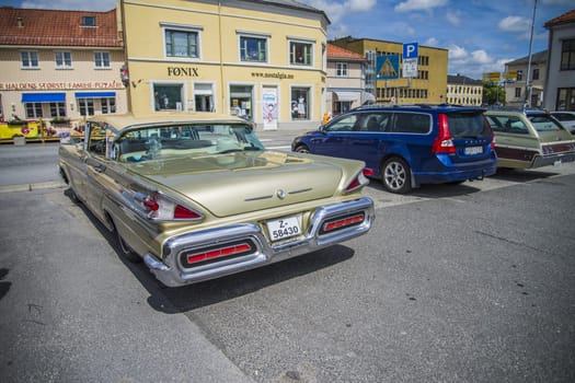 Beautifully restored classic American car. The photo is shot at the fish market in Halden, Norway.