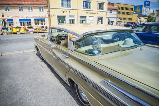 Beautifully restored classic American car. The photo is shot at the fish market in Halden, Norway.