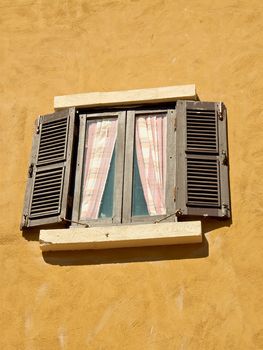 Vintage window on orange  cement wall can be used for background