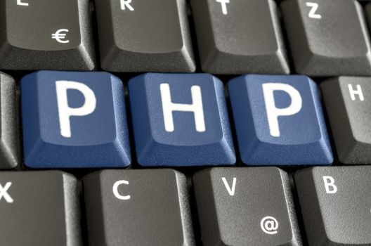 PHP written with blue keys on computer keyboard.