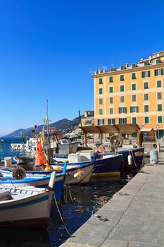 small harbor with fishing boats in Camogli, Liguria, Italy