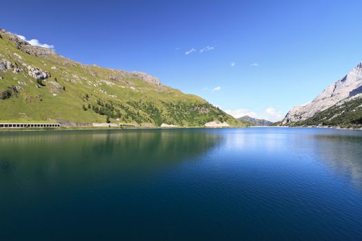 summer landscape of Fedaia lake and pass, Trentino, Italy