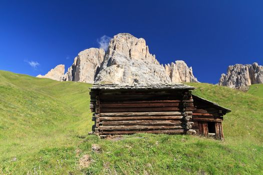 	barn beneath Sassolungo mount, Fassa Valley, Trentino, Italy
