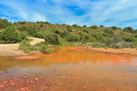 Sardinia - Piscinas stream: the red color is due to abandoned iron mines upstream
