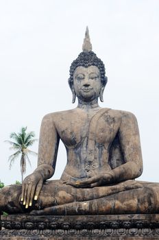 Statue of a deity in the Historical Park of Sukhothai, Thailand