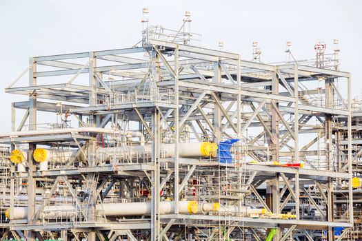 Assembling of liquefied natural gas Refinery Factory with LNG storage tank using for Oil and gas industry background