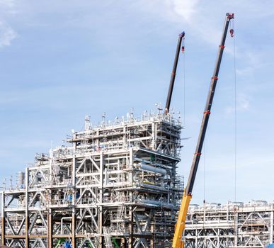 Assembling of liquefied natural gas Refinery Factory with LNG storage tank using for Oil and gas industry background