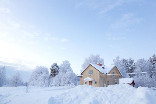Winter landscape with house at Kiruna Sweden