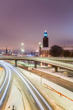 Stockholm Cityhall at night with transportation light trail Sweden