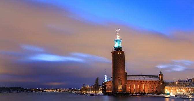 Panorama Stockholm Cityhall at dusk with transportation light trail Sweden