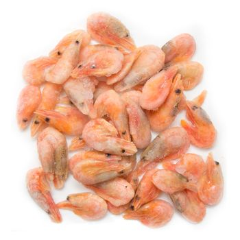 Frozen marine King prawns in a transparent dish 