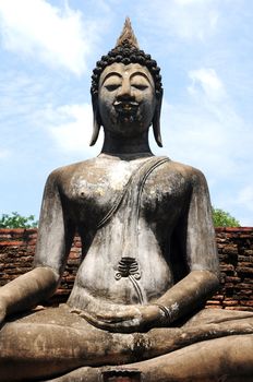 Statue of a deity in the Historical Park of Sukhothai, Thailand