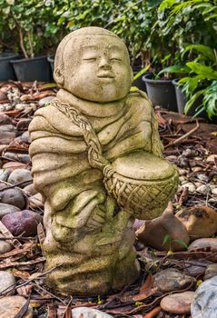 Funny traditional Thai garden monk sculpture