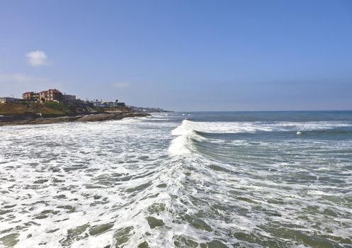 Ocean wave and foam along the California coastline southwest USA.