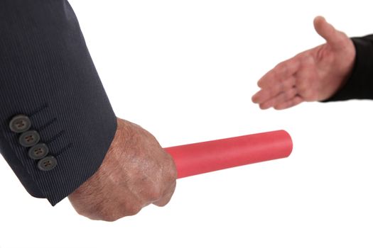 Businessman passing on a baton