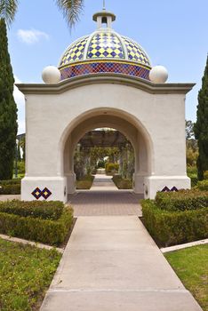 Balboa Park arches promenade and plants in San Diego California.