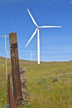 Wind turbines creating energy on a hillside in Eastern Washington.