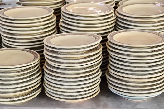 stack of ceramic plates in outdoor market