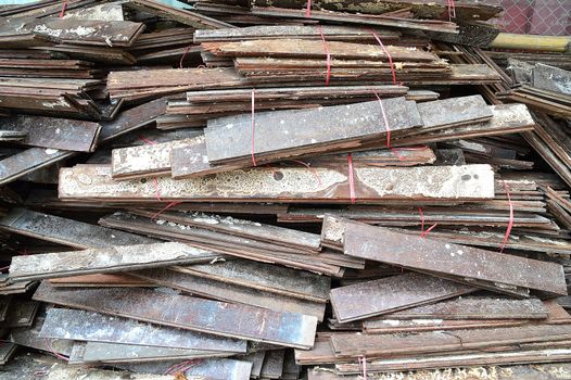 Stack of old wooden studs at a lumber yard