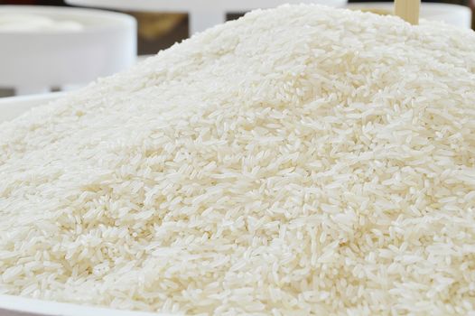 White long rice background, uncooked raw cereals, macro closeup