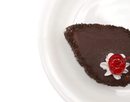 dessert - chocolate cake with fresh cherry in dish on a white