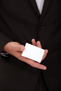 Businessman displaying card