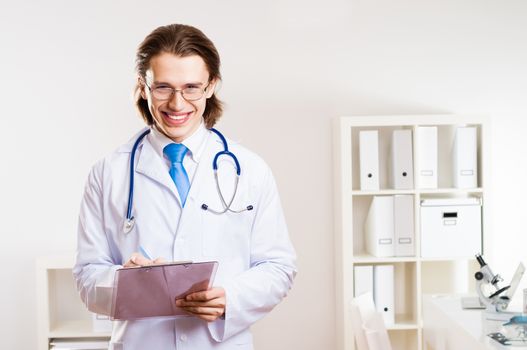 portrait of a doctor with a clipboard takes notes