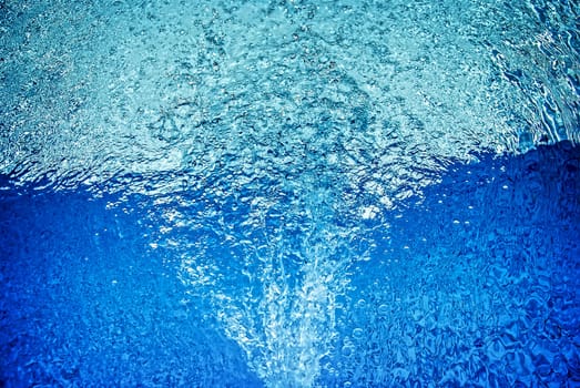 closeup of bubbles in blue water