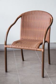 Brown rattan and metal frame chair