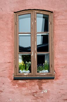 old ornamented window with flowers