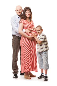 Pregnancy and new life concept - smiling father and little child boy touching or bonding pregnant mother abdomen